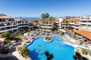 an aerial view of a resort with a swimming pool at Oceanfront 2 bedrooms Holiday Home in Tenerife South in San Miguel de Abona