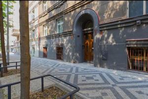 a building with a staircase in front of a building at Lenka's cozy Red studio + Lenka's cozy Gold apartment in Prague