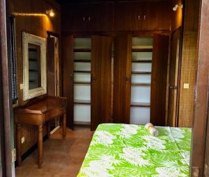 Postel nebo postele na pokoji v ubytování Faré Anaiti Moorea