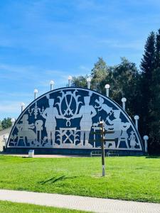 a large monument in a park with a mural on it at Ferienwohnung Johanngeorgenstadt in Johanngeorgenstadt