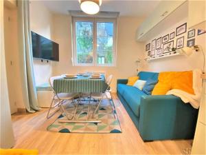 Μια τηλεόραση ή/και κέντρο ψυχαγωγίας στο Les appartements de la La perle du Laonnois +13 φωτογραφίες