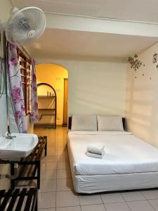 Postel nebo postele na pokoji v ubytování Hotel BB Inn @ Cameron