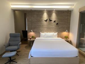 Postel nebo postele na pokoji v ubytování The Luxe Da Lat