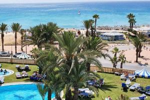 a view of a resort with a pool and a beach at appt Mahari in Yasmine