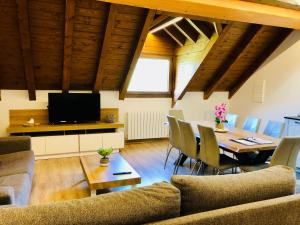 a living room with a couch and a table at Apartamentos Zabalarena Basoa in Orbaiceta