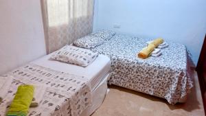 two twin beds in a room at Apartamento Las Brisas in Mijas