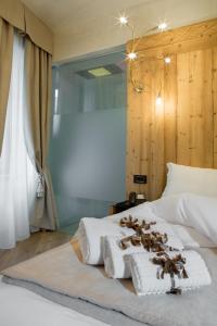 Postel nebo postele na pokoji v ubytování Hotel Orso Grigio