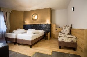 Postel nebo postele na pokoji v ubytování Hotel Orso Grigio