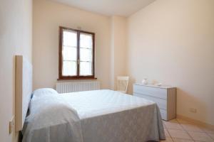 A bed or beds in a room at La Casa dell'Olivo