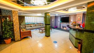 a lobby with a living room and a couch at Gardan Hotel in Beylikduzu