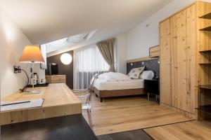Postel nebo postele na pokoji v ubytování Hotel Orso Grigio