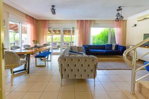 a living room with a couch and a table at Paradise Town Villa Abel 100 MBPS free wifi in Belek