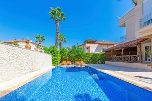 a swimming pool in the backyard of a house at Paradise Town Villa Abel 100 MBPS free wifi in Belek