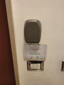 a paper towel dispenser on a door at Casa Twins in Bari