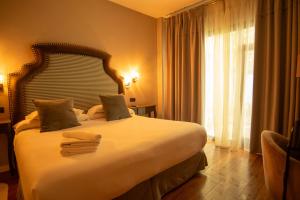 Postel nebo postele na pokoji v ubytování Hotel Don Juan Boutique
