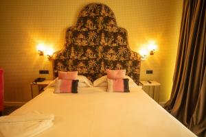 Postel nebo postele na pokoji v ubytování Hotel Don Juan Boutique