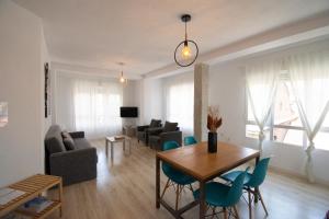 Телевизор и/или развлекательный центр в Apartamentos Centro Granada