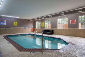 a large swimming pool in a building at Super 8 by Wyndham Salisbury in Salisbury