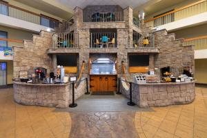 a large stone building with a counter in a mall at Baymont by Wyndham Shakopee in Shakopee