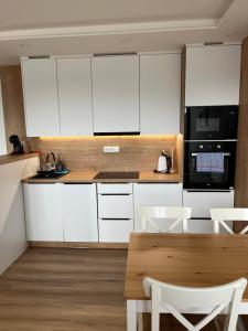 Kuchyň nebo kuchyňský kout v ubytování Apartmán Plešivec ALL4FUN u sjezdovky