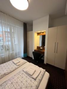 Ένα ή περισσότερα κρεβάτια σε δωμάτιο στο Pitypang Apartman Hajdúszoboszló