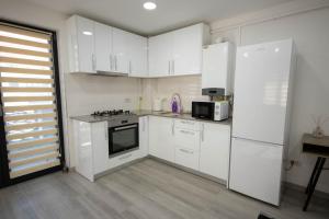 Kuchyň nebo kuchyňský kout v ubytování AStar Apartments - Executive