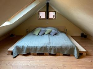 a bedroom with a bed in a attic at Ferienhaus Königstein in Königstein an der Elbe