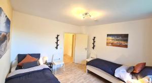 Ένα ή περισσότερα κρεβάτια σε δωμάτιο στο Perfect Apartment in Unna close to Dortmund +1 φωτογραφίες