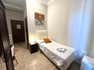 Postel nebo postele na pokoji v ubytování Golden Milano Hotel