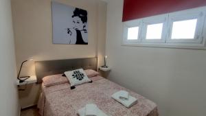 Ein Bett oder Betten in einem Zimmer der Unterkunft Ancorà Angela - Playa del Inglès