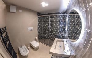 a bathroom with a sink and a toilet at Fabroniana apartment Elegant in Pistoia