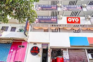 a building with signs on the side of it at OYO Flagship Ab Hotel in Patna