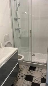 a white bathroom with a shower and a toilet at Appart.confortable, place Dupuy. in Toulouse
