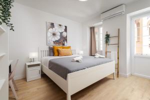 Giường trong phòng chung tại Nordik Rooms Urban - Centro "Estocolmo"