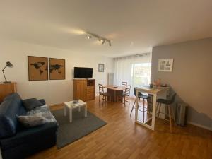 a living room with a couch and a table at Appart T2 quartier santé et Agro in Rennes