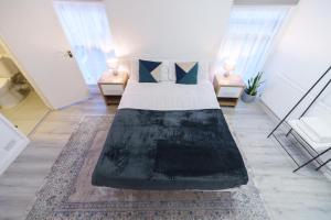 Ένα ή περισσότερα κρεβάτια σε δωμάτιο στο Seafront Retreat Studio Flat Cleethorpes Beach