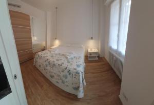 A bed or beds in a room at Appartamenti Reali Bonaccini
