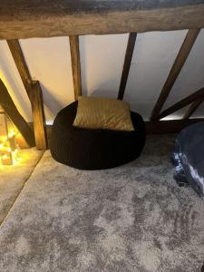 a bean bag chair sitting in the corner of a room at The Coach House by Phoenix Premises - Hot Tub Fire Pit BBQ Log Burner Bar Games Room in Birmingham