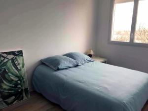 Postel nebo postele na pokoji v ubytování Superbe appartement proche Bordeaux pied du tram