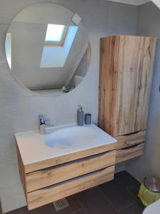 a bathroom with a sink and a mirror at Sana in Postojna