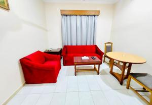 Posezení v ubytování Al Ghadeer Hotel Apartment
