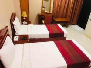 Postel nebo postele na pokoji v ubytování Al Ghadeer Hotel Apartment