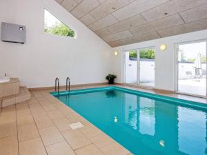 a large swimming pool in a house with at 10 person holiday home in Grenaa in Grenå