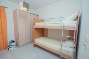 a bunk bed room with two bunk beds and a ladder at Silva Luxury House in Mires (South Crete) in Moírai