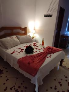 Cama ou camas em um quarto em Hotel Lumiar