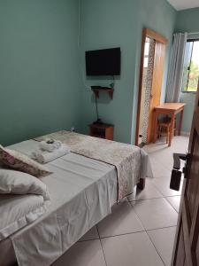 Cama ou camas em um quarto em Hotel Lumiar