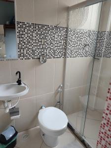 Um banheiro em Hotel Lumiar