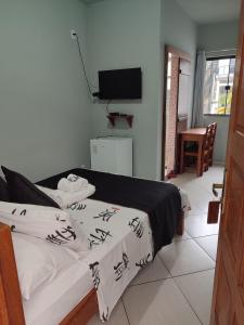 Cama ou camas em um quarto em Hotel Lumiar