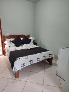 Cama ou camas em um quarto em Hotel Lumiar
