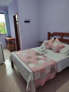 Cama ou camas em um quarto em Hotel Lumiar